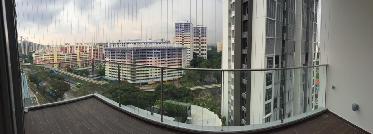 Invisible grille on a condo balcony with city view